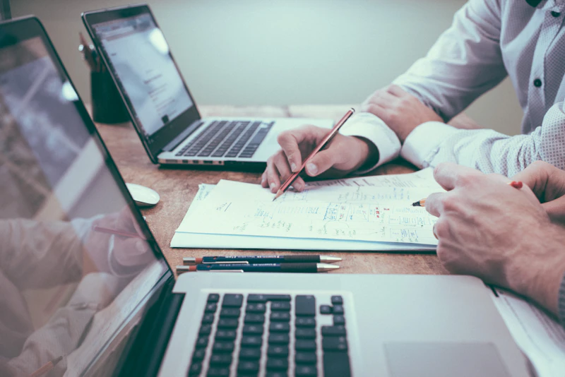 Network architect reviewing technology roadmap and infrastructure documentation