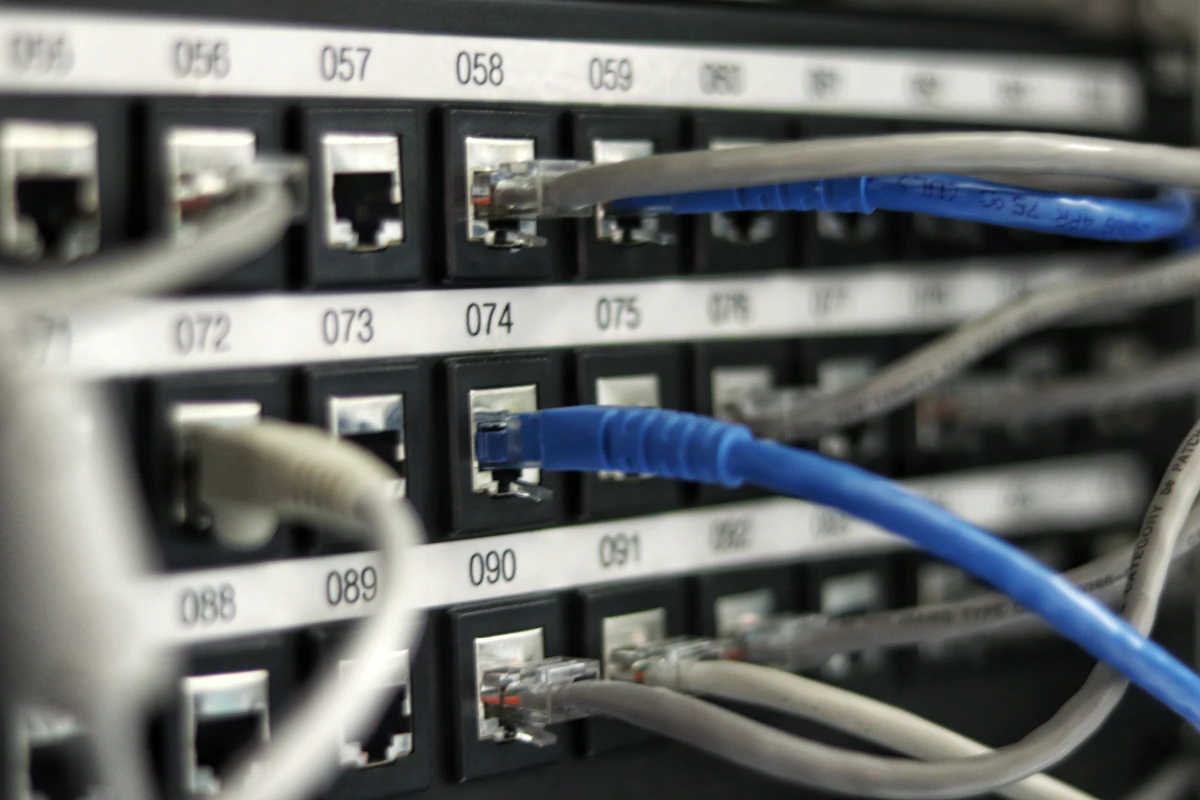 Labeled patch panels and switch ports documented in a network IDF rack