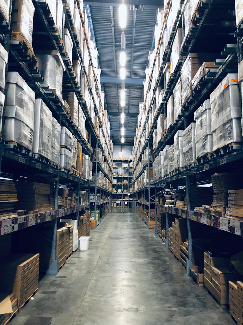 Warehouse facility with industrial network infrastructure and racking aisles
