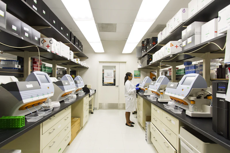 Genomics laboratory with rows of benchtop sequencing instruments and sample storage