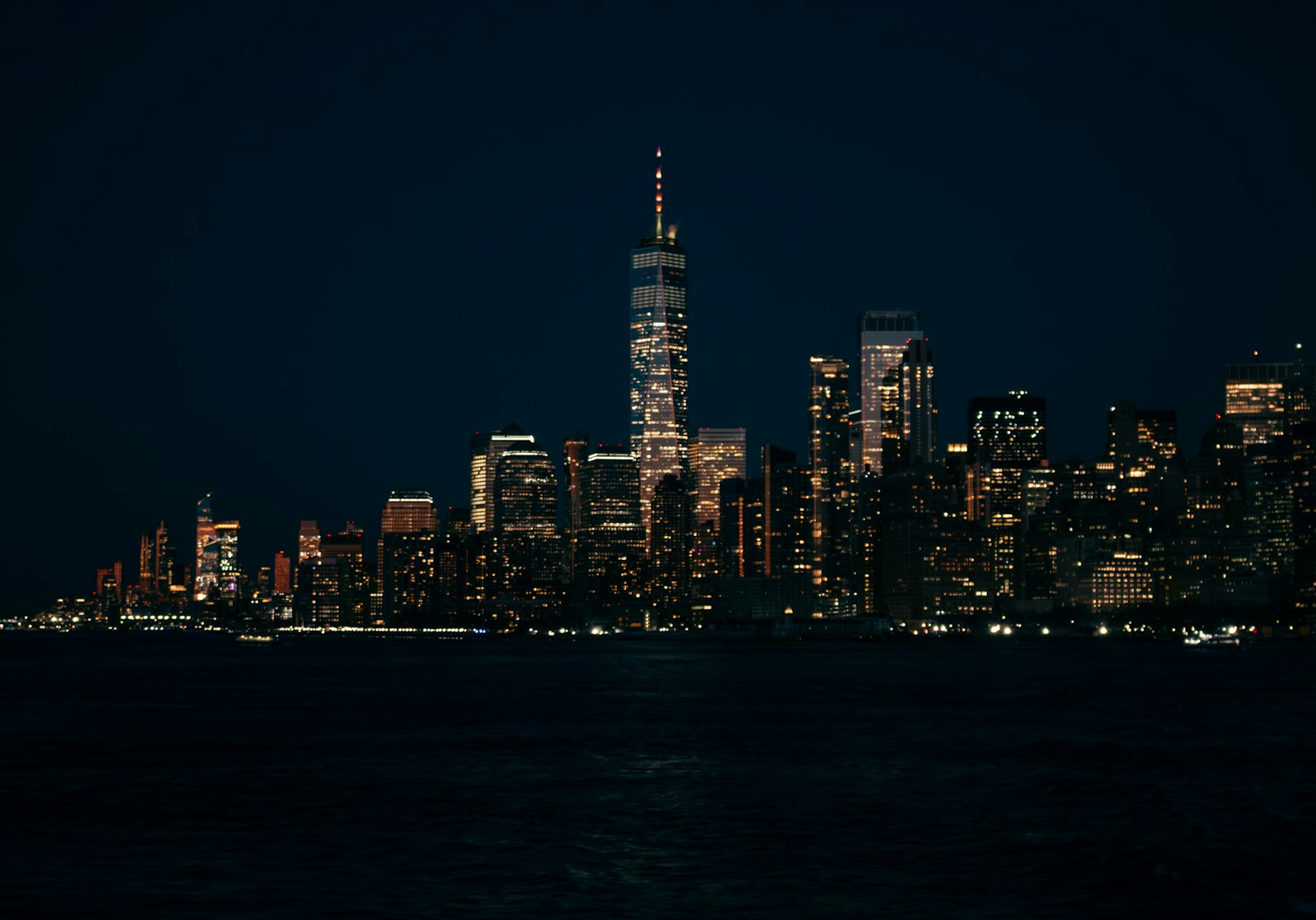 Lower Manhattan skyline across the East River at night